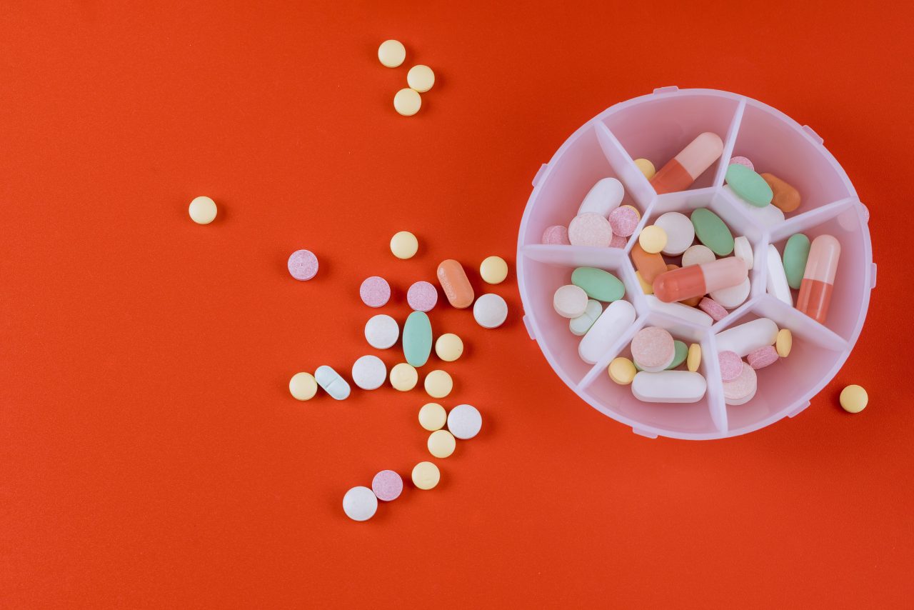 colorful-pills-tablets-antibiotic-on-red-backgroun-2022-10-21-01-37-42-utc-1280x854.jpg