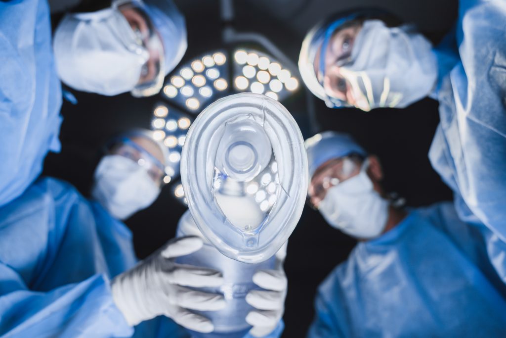low-angle-view-of-anesthetist-holding-oxygen-mask-2022-06-27-20-49-25-utc-1024x683.jpg